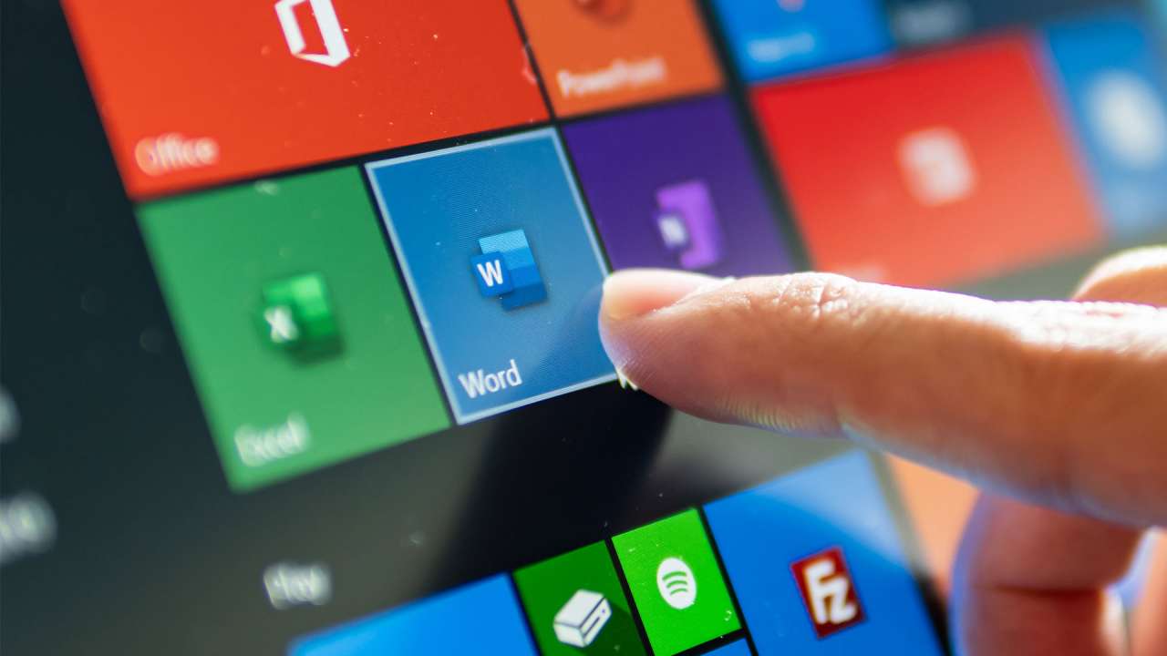 A finger tapping an antivirus app on a touch screen